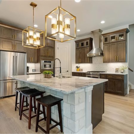 Dark-brown-cabinets-gold-accents-light-stone-scaled.jpeg