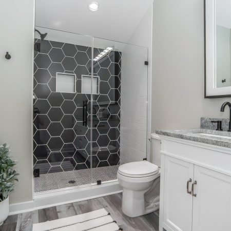 Hex-Shower-wall-tiles-gray-lvp-elegant-light-scaled.jpeg