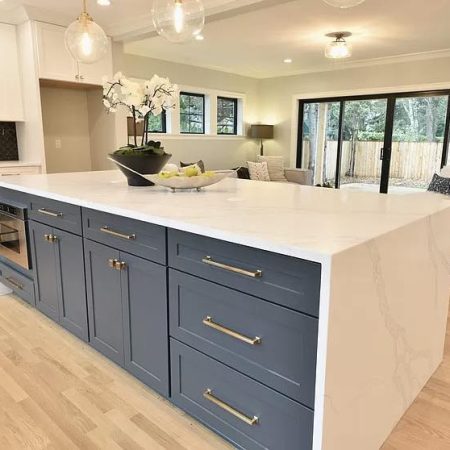 blue-base-cabinets-white-waterfall-countertops.jpg